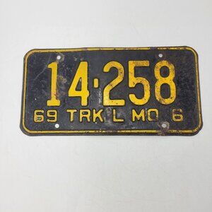 Antique 1969 Missouri Truck License Plate Black Yellow